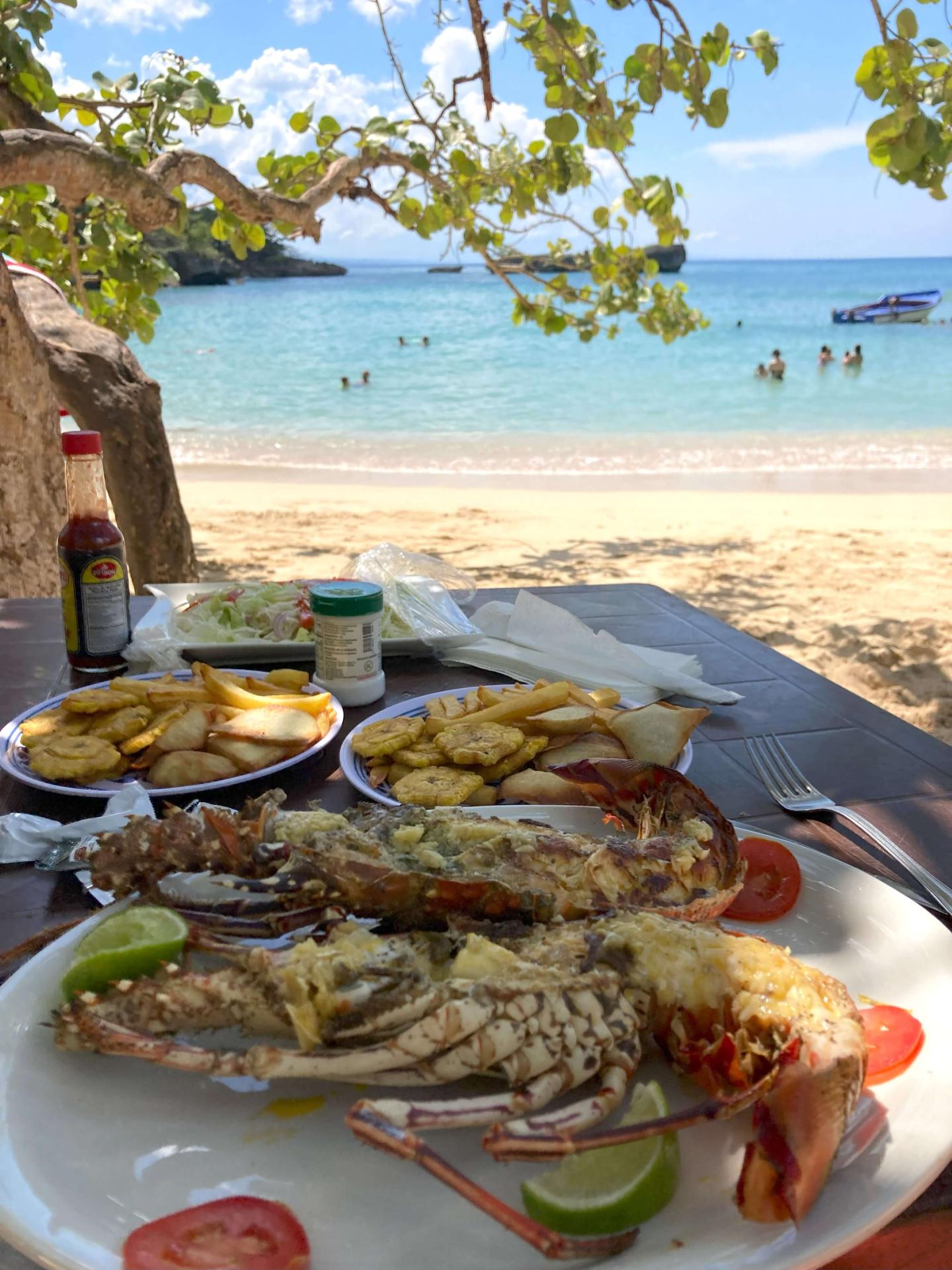 Eating fresh lobster on the beach dominican republic